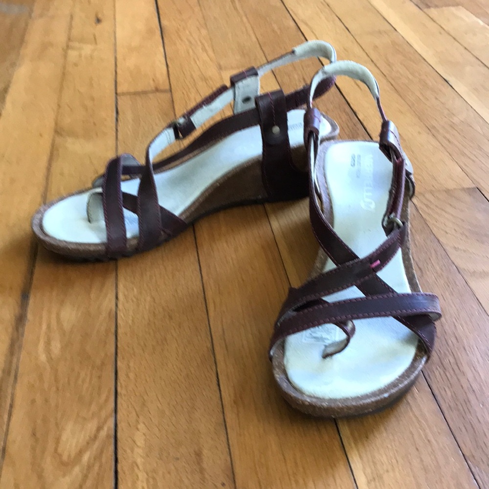 Burgundy Merrell wedge sandals.